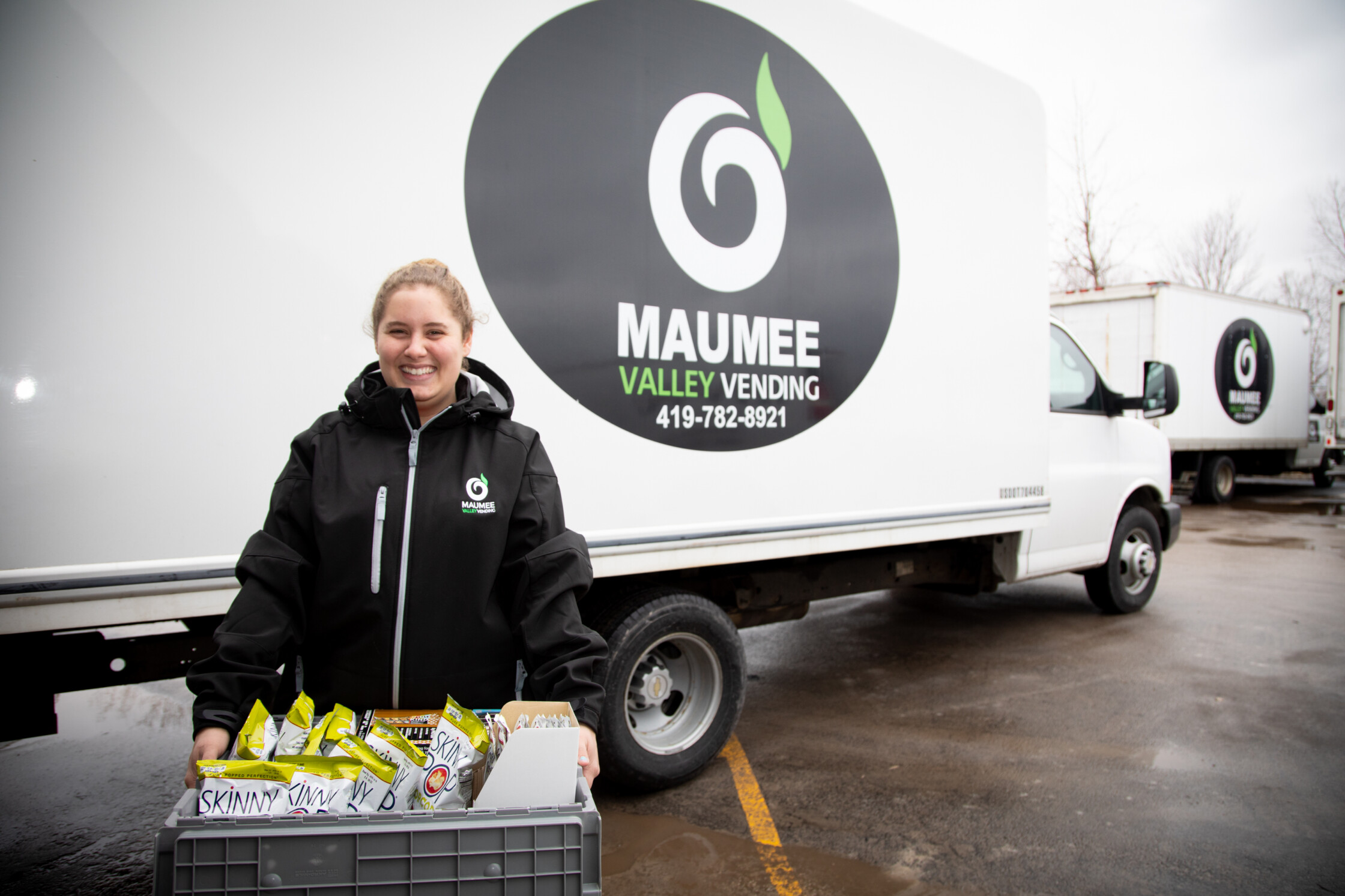 Route driver with tote full of products